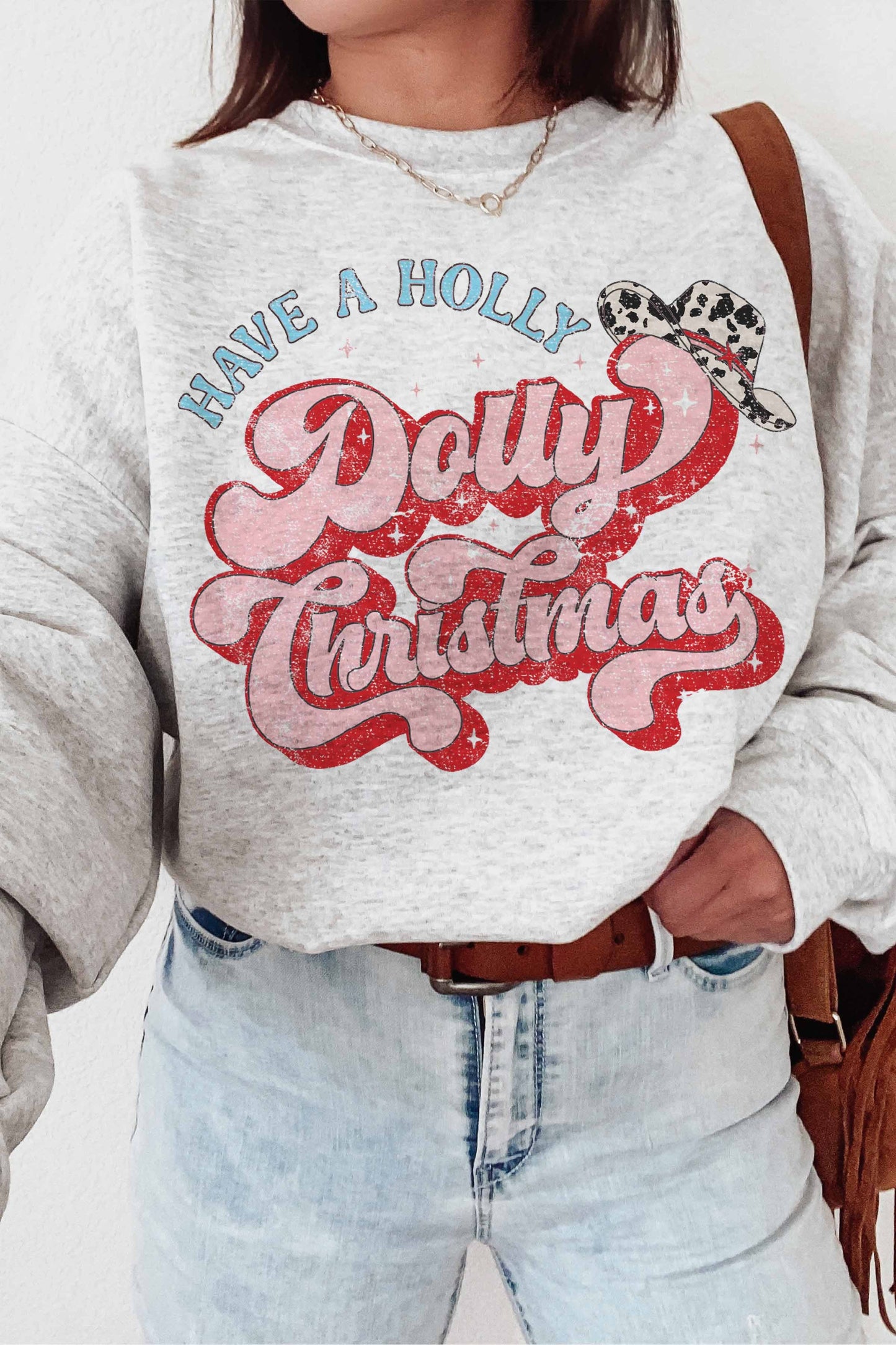 I love a good graphic and this is the perfect Christmas crewneck to add to your closet! Who doesn't love Dolly?!
Sizing: This is a unisex fit with 50% cotton, 50% po