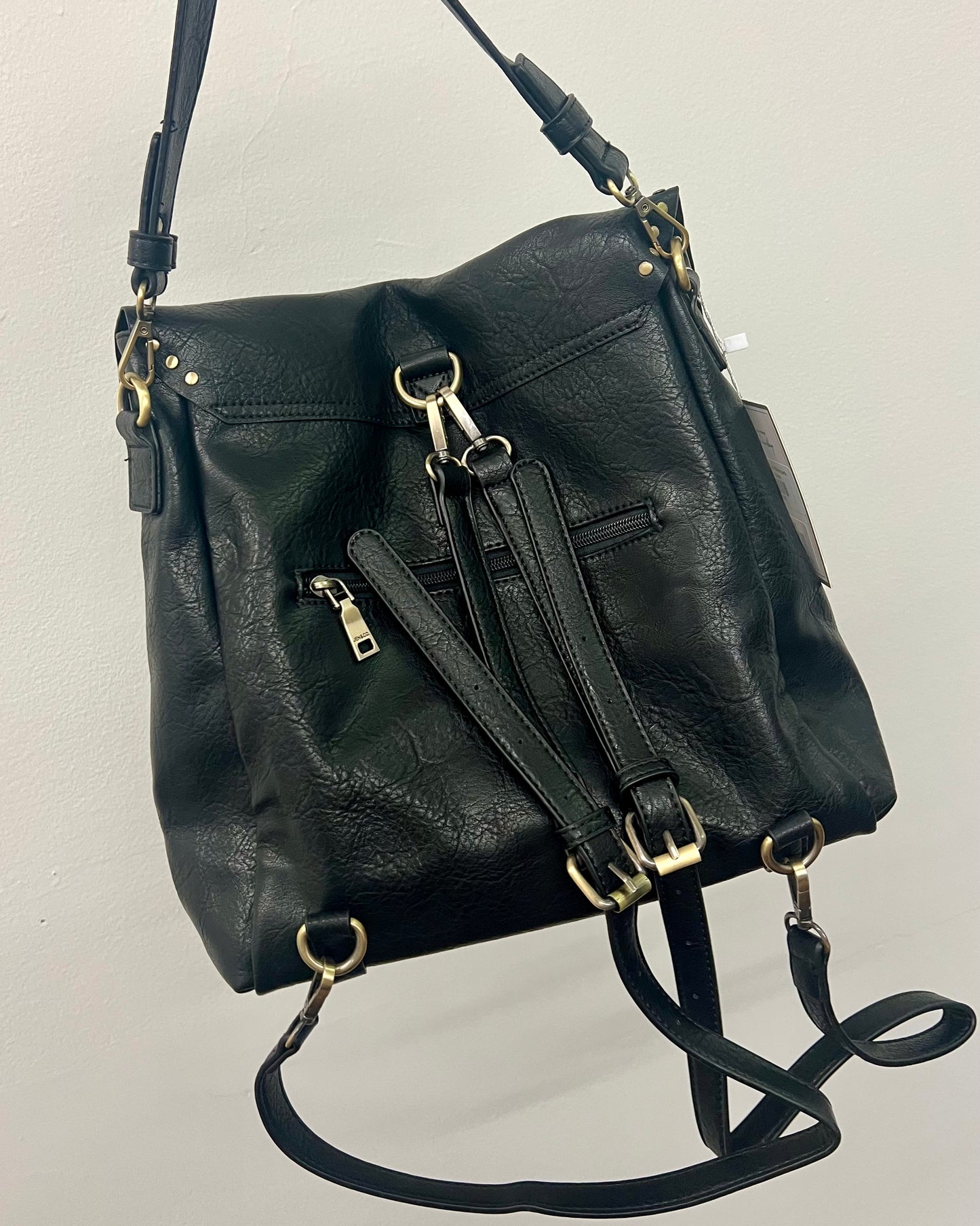 A Backpack that can also be carried as a purse! This lightweight bag is a great transition bag and has a stunning gold studded detail! Available in two colors!